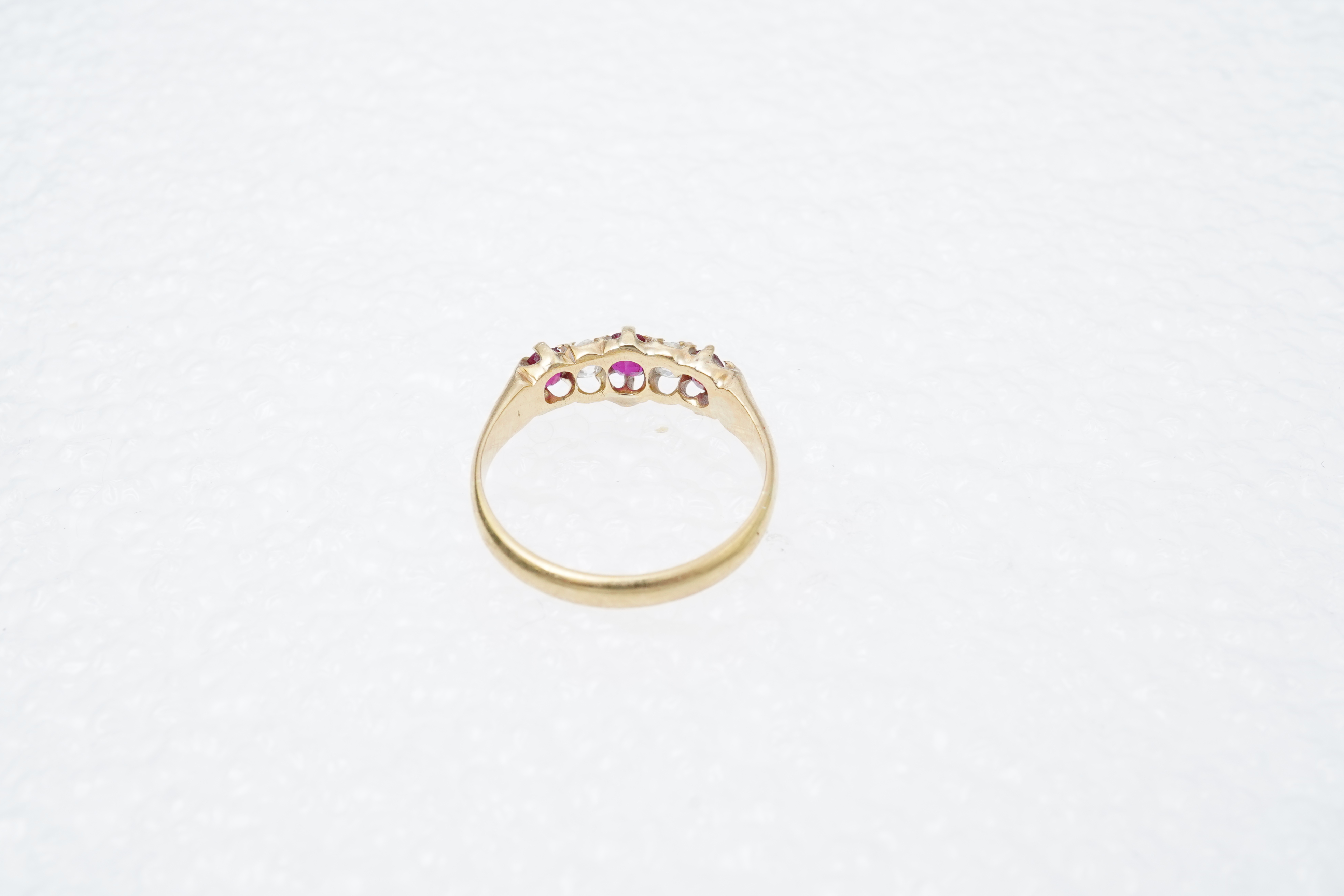 A ruby and diamond five-stone ring, circa 1900